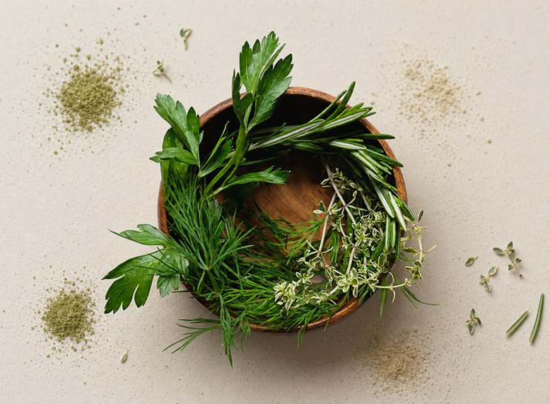 Fresh herbs arranged in a circular wreath
